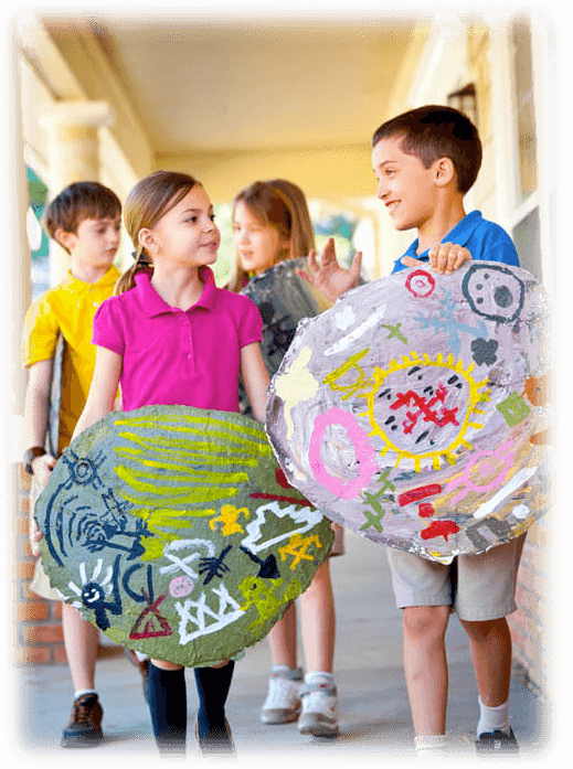 Kids holding art.